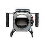 Front view of the Salty SIREN housing for the Sony FX6, featuring a rugged metal body with dual textured side handles and a large circular lens port opening. Built for ocean photography, the housing includes a stable skid base and external control dials.