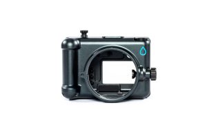 A sleek black underwater camera housing designed for Fujifilm cameras is displayed on a white background, featuring a large lens port opening, control dials, and Salty Surf Housings logo on the top right corner.