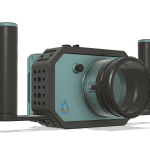 A digital render of the Nikon ZR Compact Camera Housing by Salty Surf Housings, featuring a streamlined, two-tone body with dual side handles, a prominent front lens port, and the brand’s blue water droplet logo.